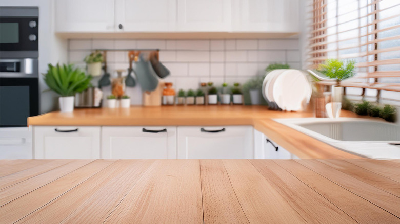 A clean and organized wooden kitchen counter top.