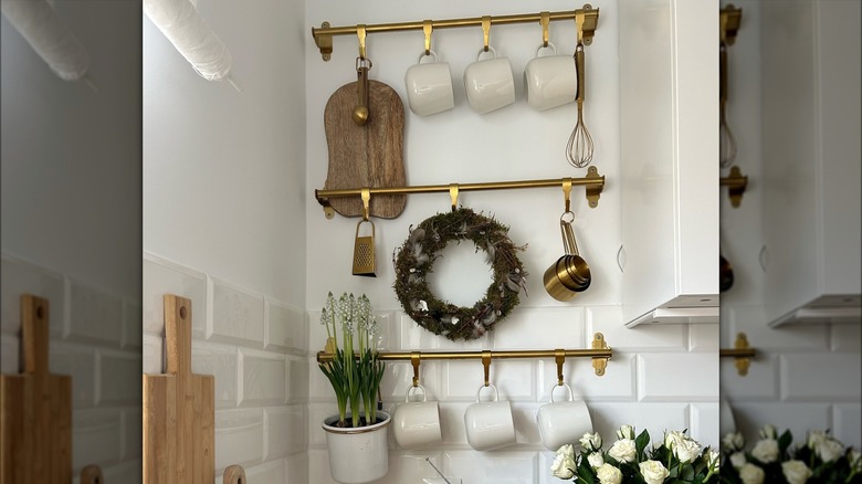 wall rack with mugs and kitchen tools