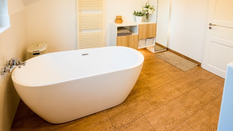 Freestanding bathtub in bathroom