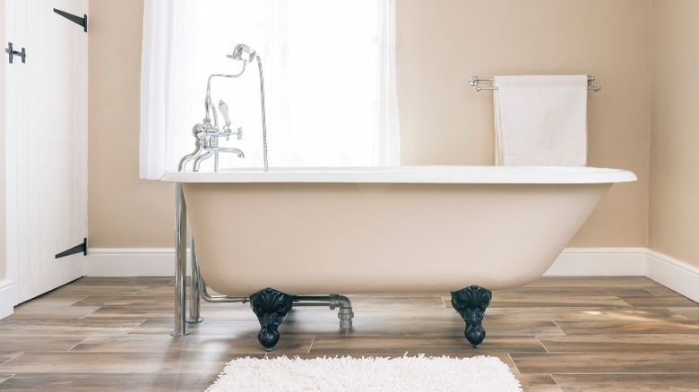 Tub with floor-mount faucet