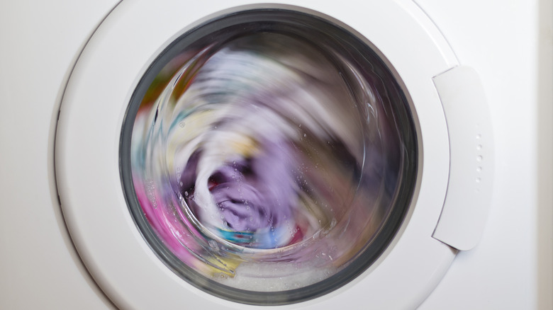 A front-load washer running