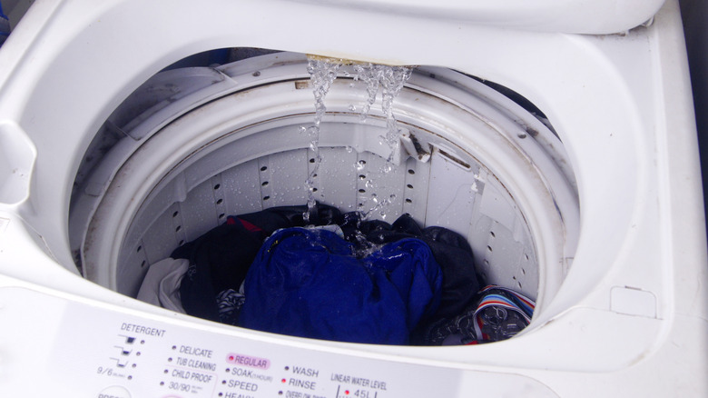 Water pouring into a top-load washer