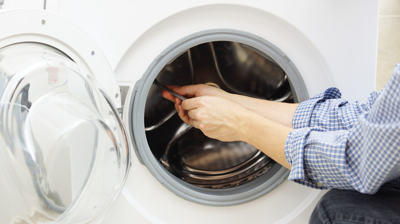 Person installing washing machine