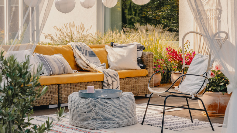 patio with curtains and pillows