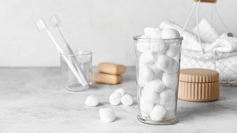 cotton balls in glass container