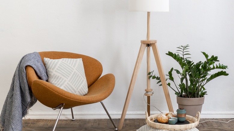 Arm chair and floor lamp with legs