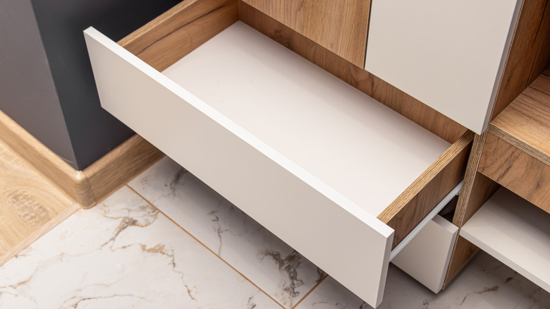 Furniture with an open drawer