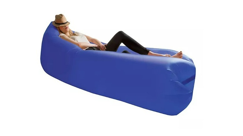 Woman on blue inflatable lounger