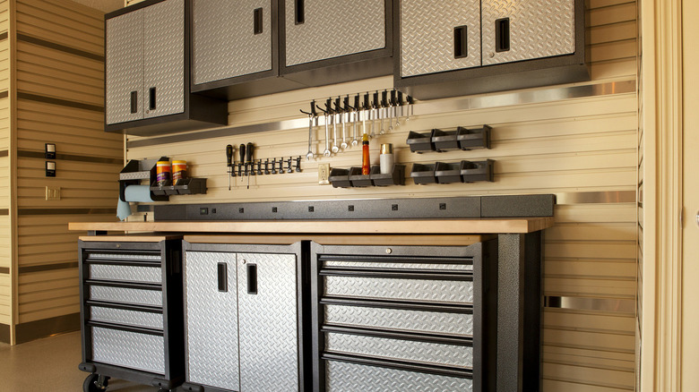 Cabinets, table in garage workspace 