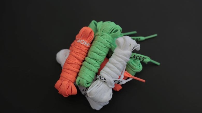 White, green, and orange shoelaces