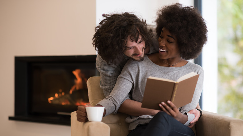 Couple by a fireplace