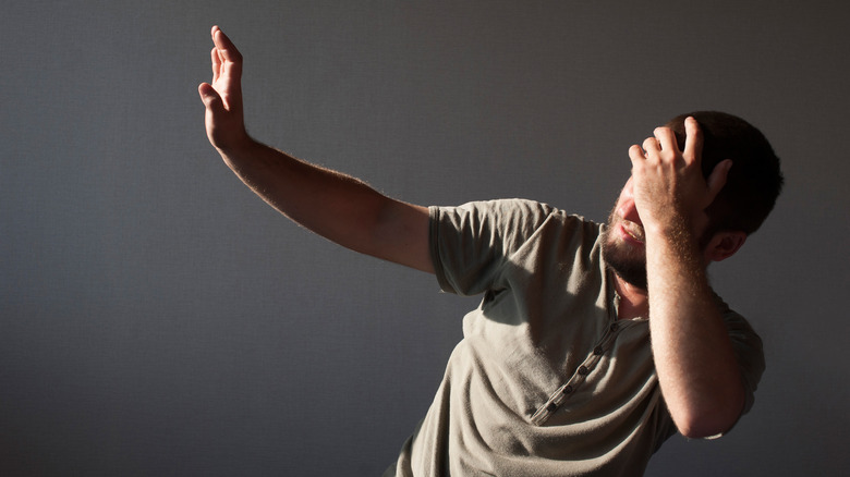 Woman laying in bed with headache