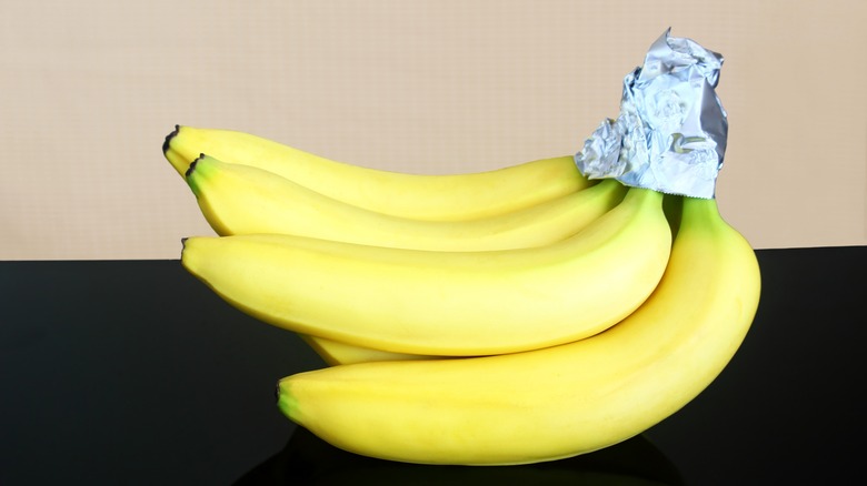 foil wrapped around banana stems