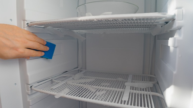 Wiping inside of freezer