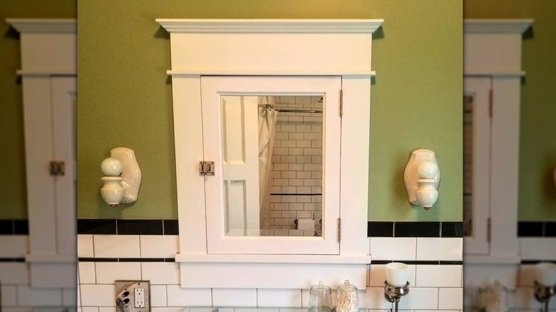 a framed inset bathroom mirror