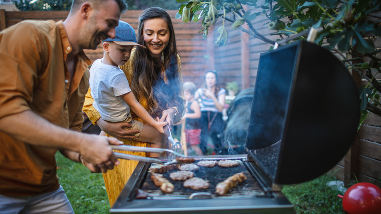 Man grilling chicken