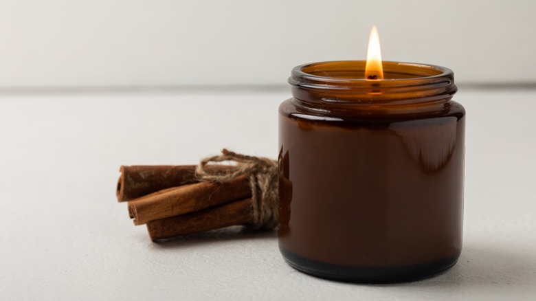 cinnamon sticks near candle