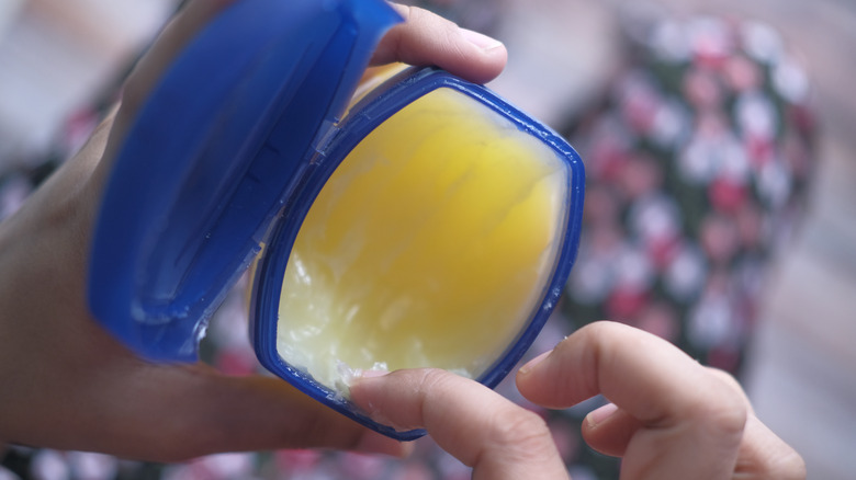 perosn using petroleum jelly