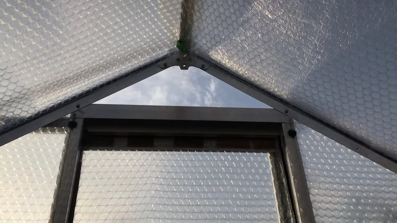 A greenhouse covered in bubble wrap 