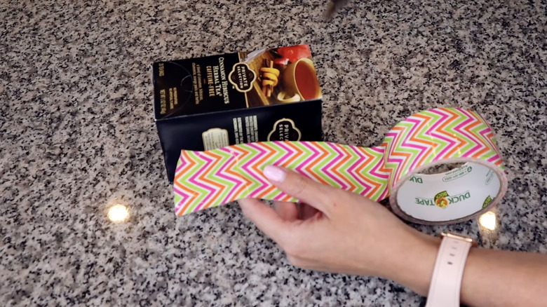 Decorative tape and a box of tea. 