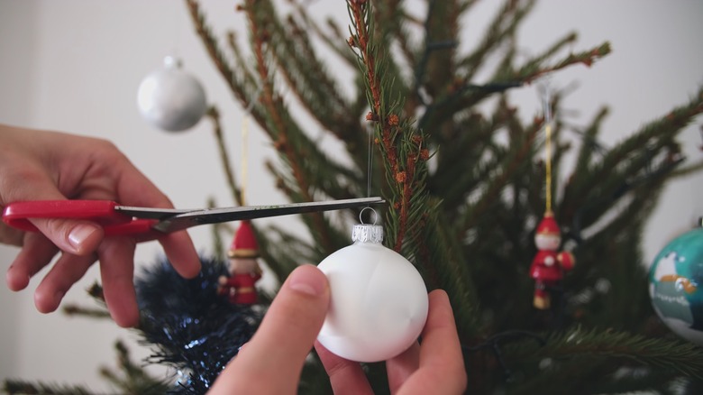 White Christmas ornament on tree