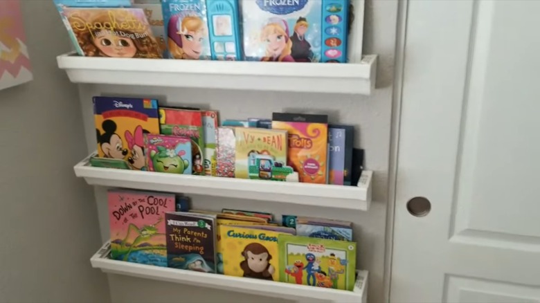 rain gutter shelves filled with books