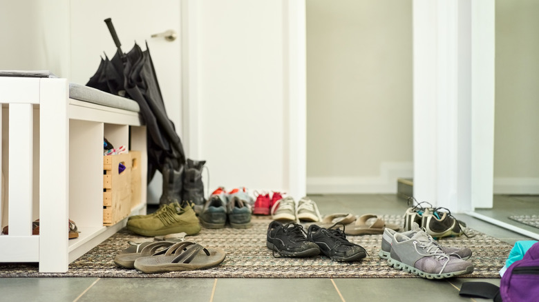 shoes scattered in home entryway