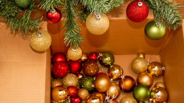 christmas ornaments in cardboard box