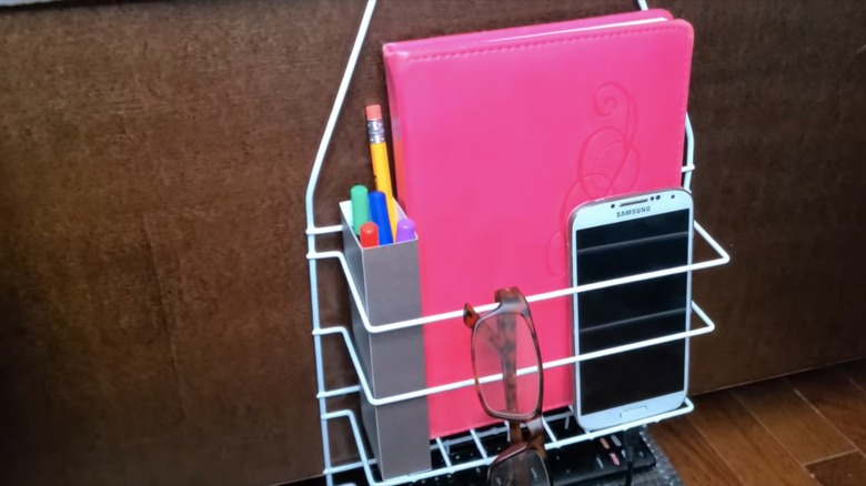 bedside caddy filled with personal items