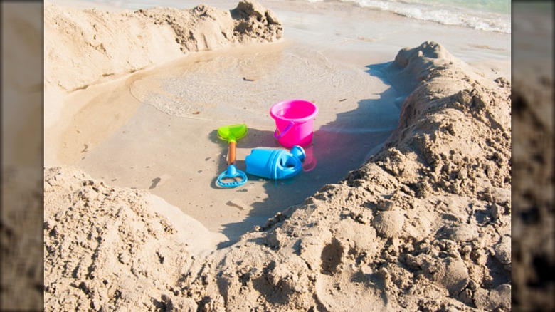 beach buckets in water