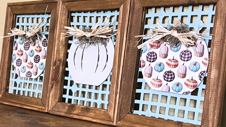 Fall wall art created from wooden frames, Dollar Tree sink mats, and pumpkin images.