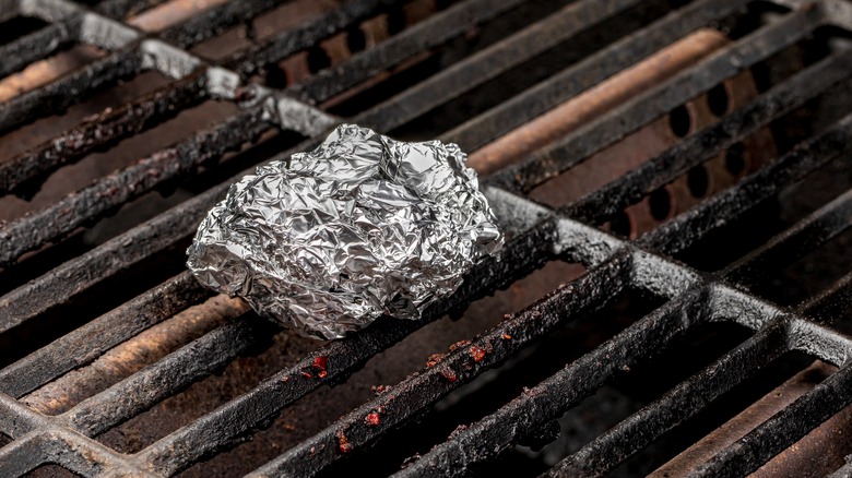 Foil ball on dirty grill grates 