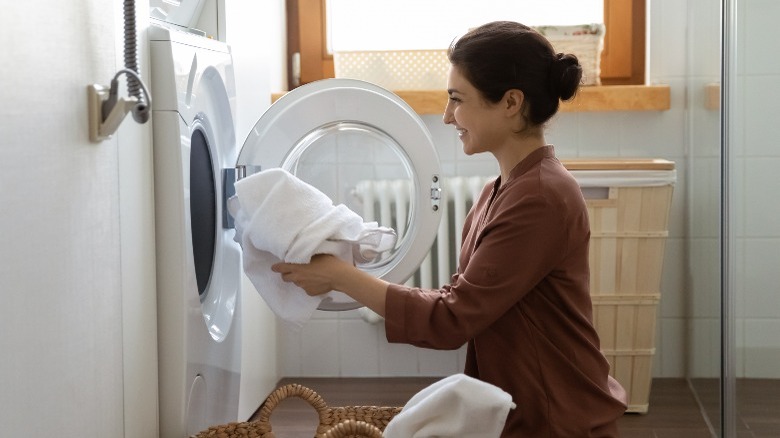 Happy woman doing laundry