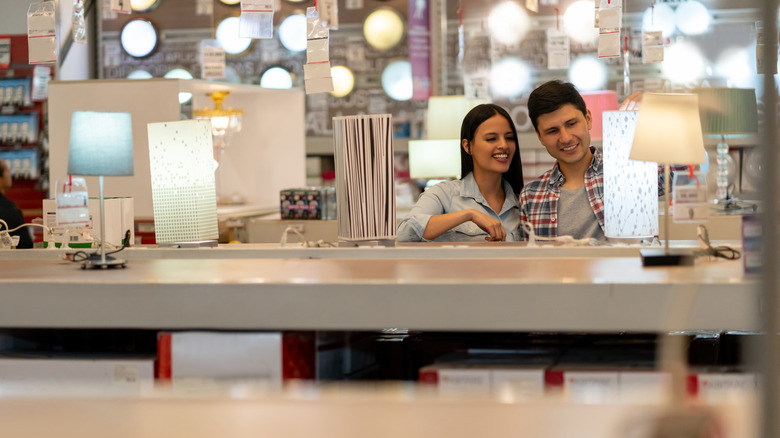 Couple shopping for lamps 