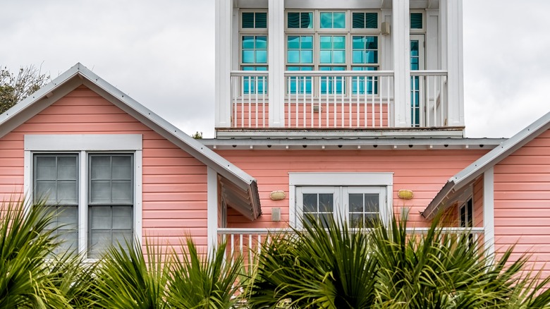 House with peach siding and white trim