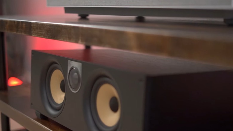 Closeup of a DIY entertainment center with speakers on shelf and set top box