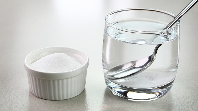 Glass of liquid and salt