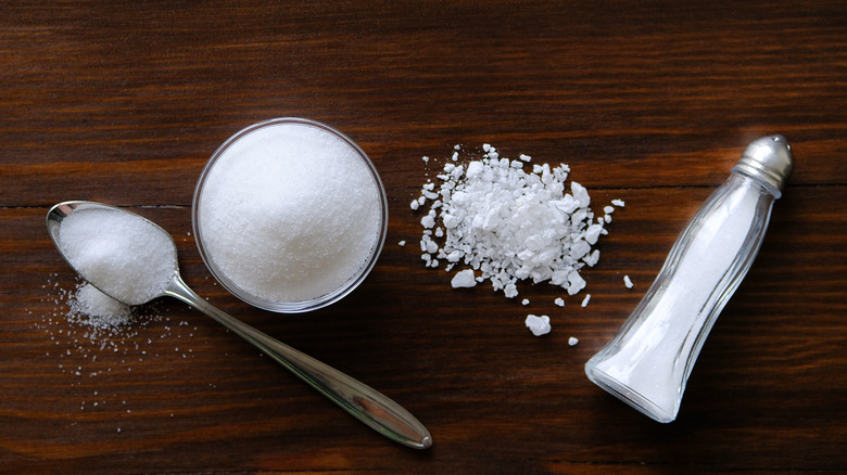 Salt in containers on table