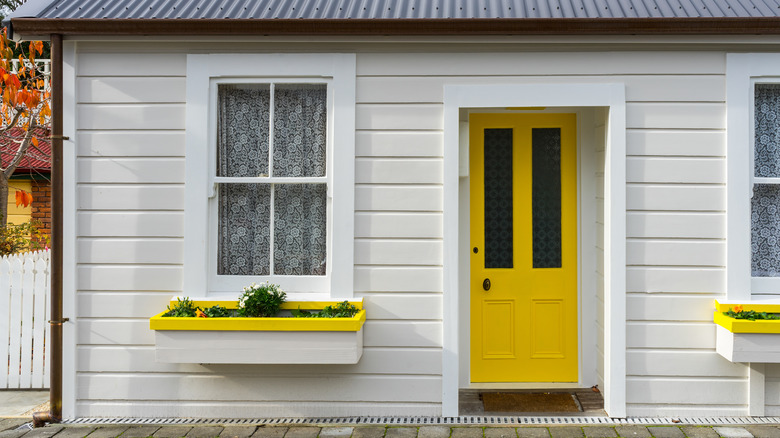 white house with yellow door
