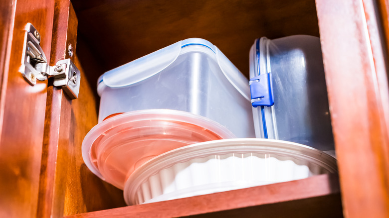 Storage containers in a cupboard