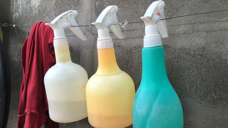 Hanging spray bottles on wire