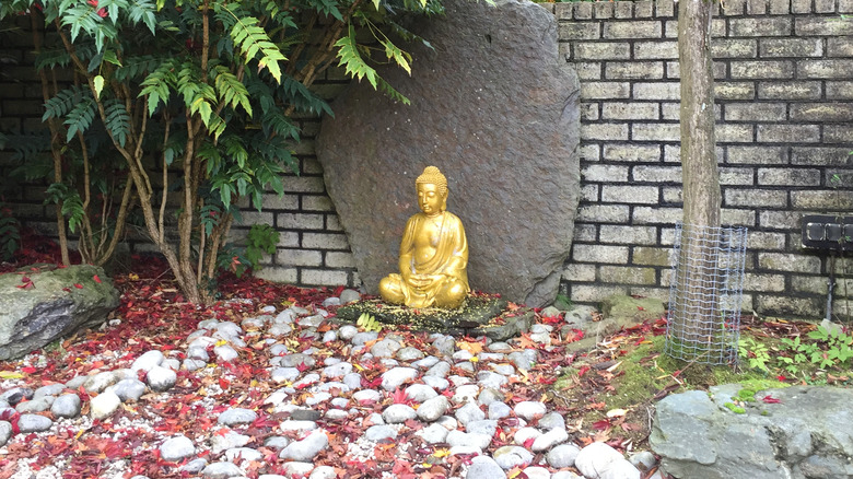 Buddha statue in rock garden