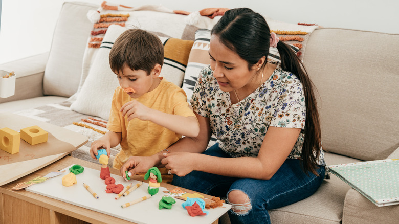 Woman and child using Play-Doh