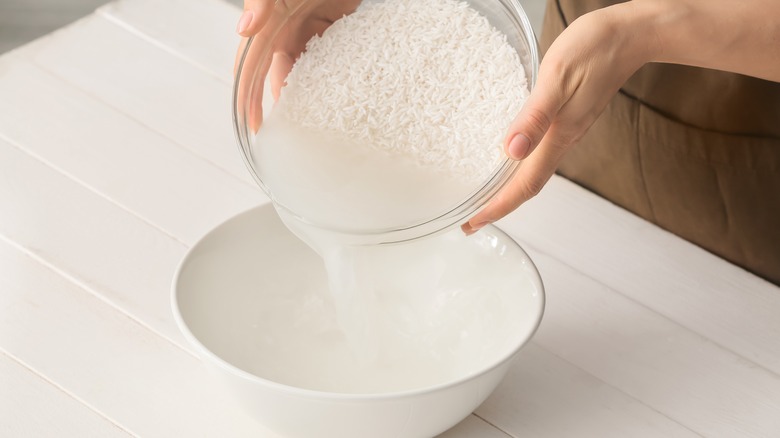 Person pouring rice water