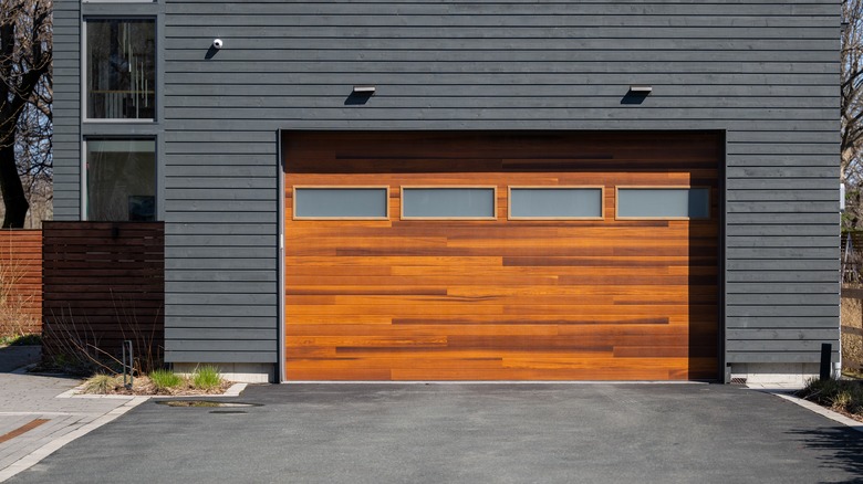 Wooden garage door on dark building