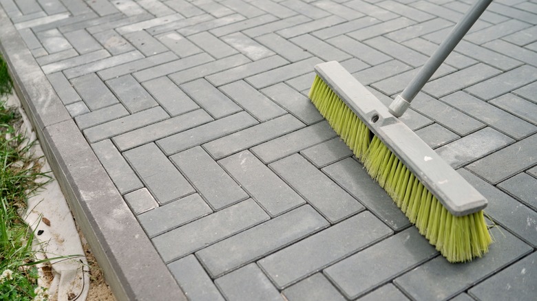 Brush cleaning stone hardscaping