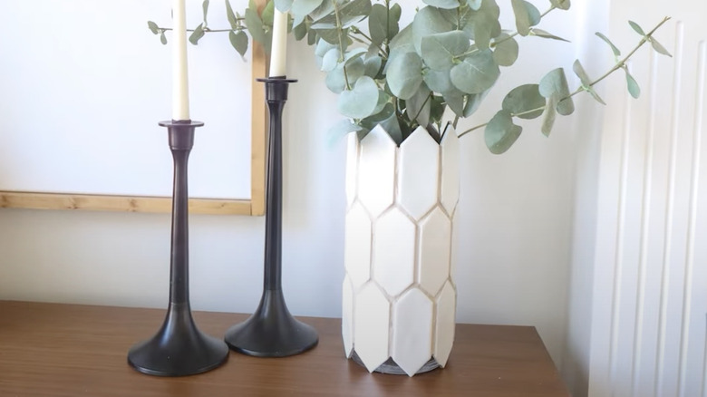 This YouTube short from lizfenwickdiy puts tiles and sand grout on a vase.