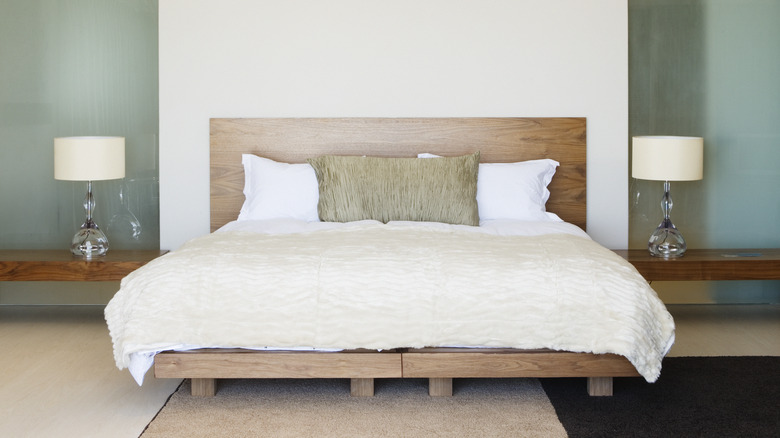 Bedroom with wooden bedframe 