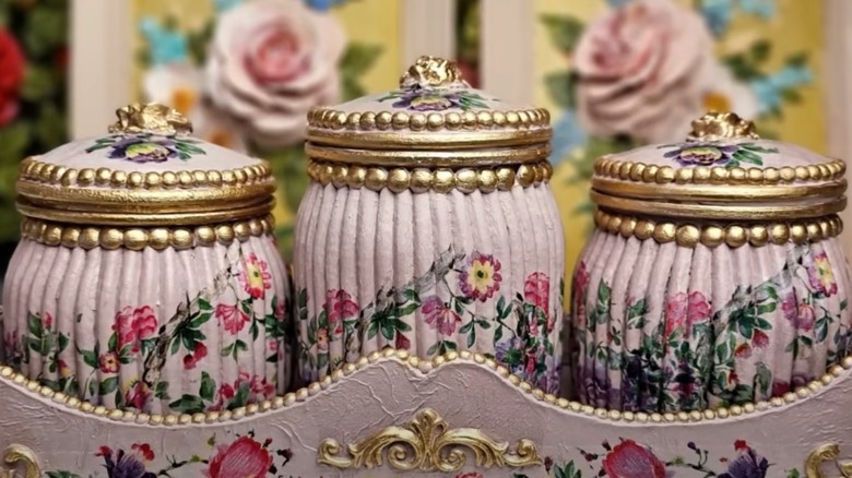 Elegant storage jars in a decorative tray