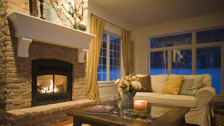 A brick fireplace in a living room